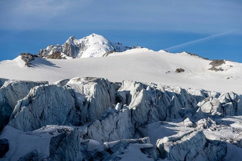 Glacier ice with crevasses, Glacier du Tour, behind summit Aiguille de Chardonnet, Chamonix,
