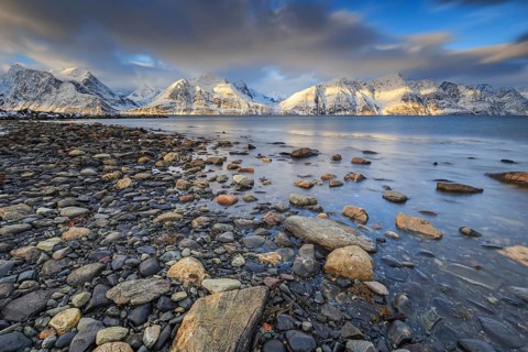 Stones, coast, snow-covered mountains, fjord, morning light, clouds, snow, Lyngen Alps, Norway,
