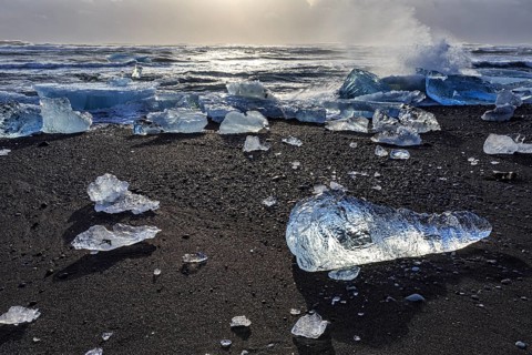 Ice floes on the beach, waves, sea, clouds, sunlight, winter, Diamond Beach, Breidamerkursandur,