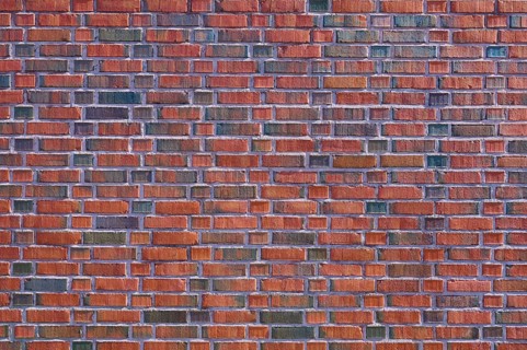Detailed view of a brick wall with red and brown bricks forming a regular pattern, Bergen,