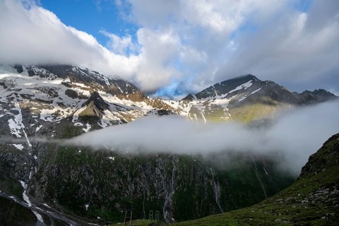 Cloudy mountain landscape with summit Hochsteller and Griesferner with snow and glacier, Berliner