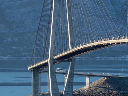 Helgeland bridge, connecting Sandnessjøen with the norwegian mainland, tourbus on bridge, Norway,