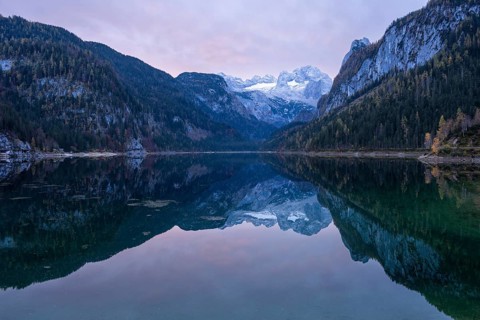 The Vordere Gosausee lake in autumn with a view of the Dachstein mountain range. The Gosaukamm on