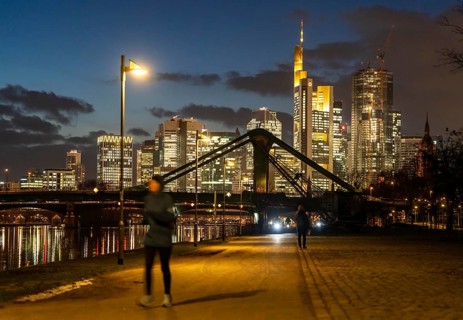 Skyline of the city centre of Frankfurt am Main, joggers on the pavement, promenade along the river