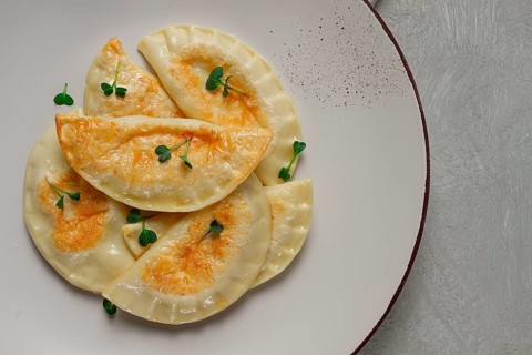 Pierogi, a traditional dish of Polish cuisine, dumplings, top view, close-up, no people