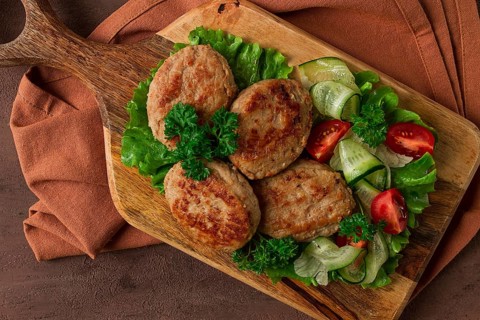 Fried cutlets, turkey, with vegetable salad, top view, no people
