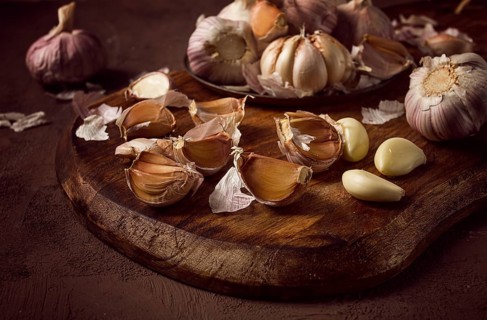 Fresh garlic, on a dark background, top view, food concept