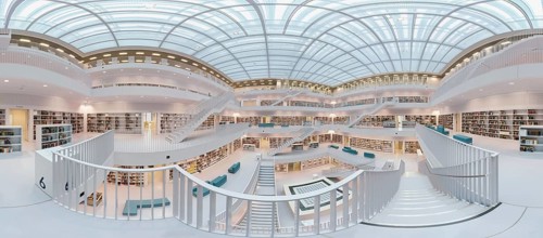 Galeriesaaal, Modern library with glass roof and white stairs, surrounded by bookshelves in a