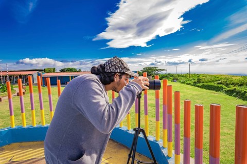 Photographer photographing a beautiful landscape. Person photographing landscape with a digital