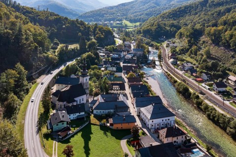 Drone image, river Traun, view of town with parish church, Lauffen, Salzkammergut, Upper Austria,