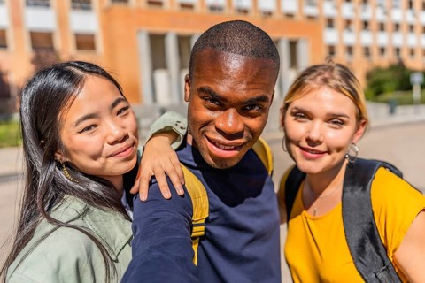 Frontal personal perspective and close-up photo of an african man taking selfie with university
