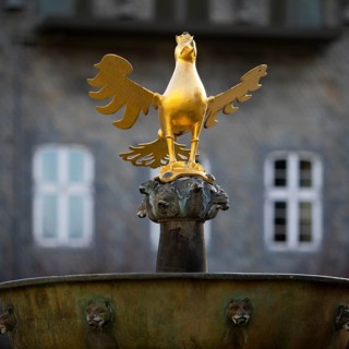 Gilded imperial eagle as a fountain eagle on the market fountain, Old Town, Goslar, UNESCO World