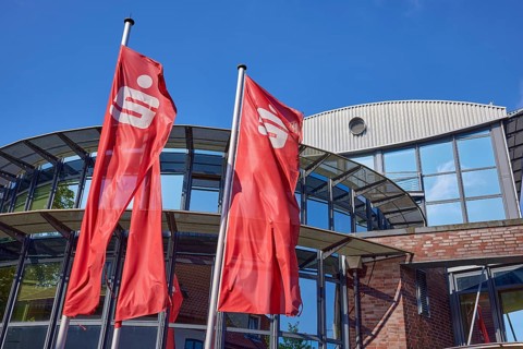 Flags with the Sparkasse logo in front of the Sparkasse Stade-Altes Land branch in Stade, Hanseatic