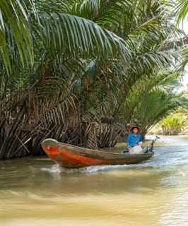 Vietnamese Woman ina rowing boat, Mekong Delta, Vietnam, Asia