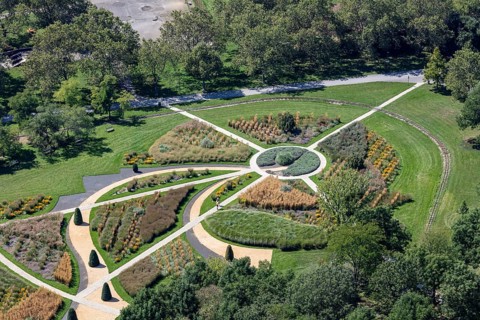 Circular garden arrangement in a public park with carefully designed beds, Vienna