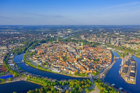 Aerial view over the river Trave and church towers in the old town of the Hanseatic City of Lübeck
