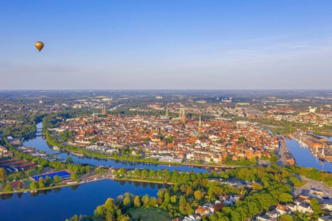 Aerial view over the river Trave and church towers in the old town of the Hanseatic City of Lübeck