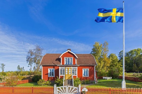 Katthult, red wooden farm house with fence from Astrid Lindgren's tales about Emil of Lönneberga at