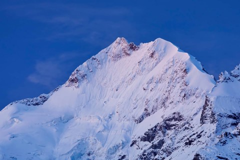 Piz Bernina and Biancograt at dawn, Engadin in the canton of Graubünden, Switzerland, Europe