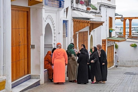 Moroccan Muslim women in traditional Islamic dress wearing hijab in medina of the city Tangier,
