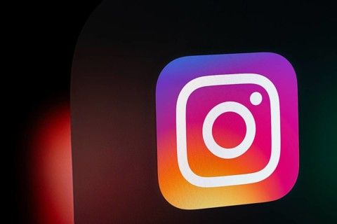 A close up of an iPad screen displaying the instagram app icon
