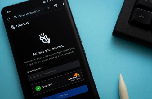 Homepage of Manus AI is seen on a smartphone