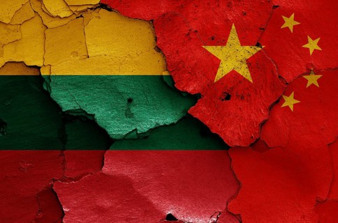 Flags of Lithuania and China painted on cracked wall