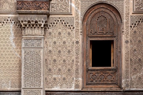 Fes, Morocco, April 04, 2023, Rich decorated facade in the courtyard of the Medersa Attarine in