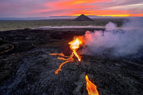 Drone image of a volcanic eruption in the evening light in Grindavik, Sudurnes, Iceland, Europe
