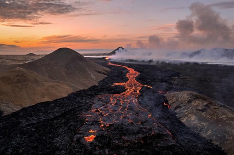 Drone image of a volcanic eruption in the evening light in Grindavik, Sudurnes, Iceland, Europe