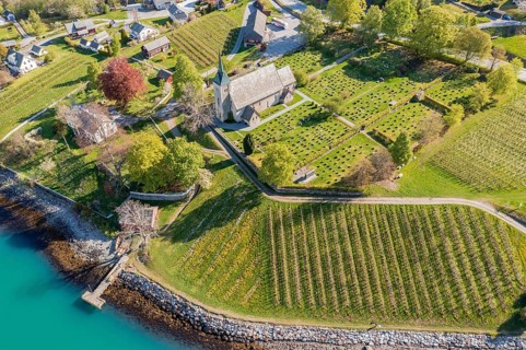 Aerial view of church and apple orchards, Ullensvang near Lofthus, Hardangerfjord, Norway, Europe
