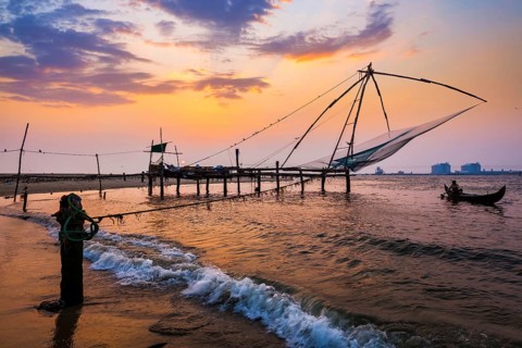 Kochi Chinese fishnets on sunset in Fort Kochin, Kochi, Kerala, India, Asia