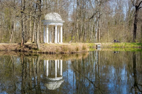 Diana Temple in Lützschena Castle Park with reflection in the water, Leipzig, Saxony, Germany,