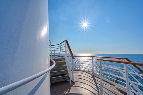 View from the deck of a cruise ship Mein Schiff 6 to the sunny sea and clear sky, North Sea,