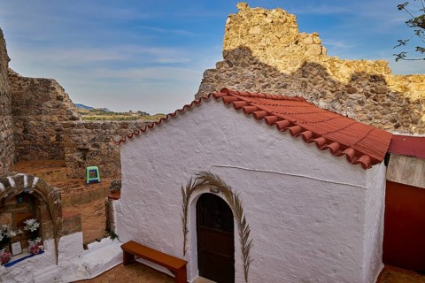 Small chapel with red tiled roof amidst ancient ruins and landscape, Archangelos, castle, place,