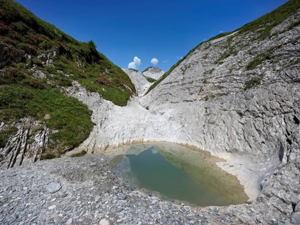 Glacier mill with glacier pots on the Trinser Alp Mora, Trin, Canton Graubünden, Switzerland,