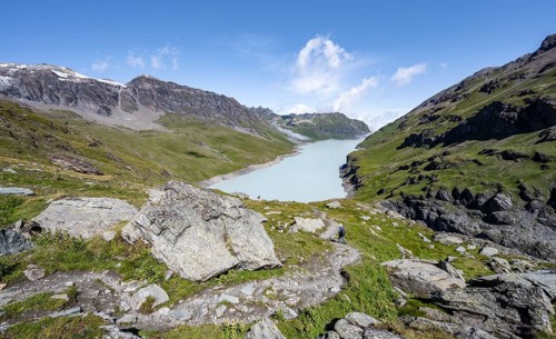 Hiking trail in idyllic mountain landscape with Lac des Dix reservoir, Valais Alps, Valais,