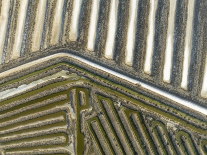 Saline ponds at the salt works near Chiclana de la Frontera. Aerial view. Drone shot. Cádiz