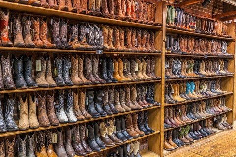 Large variety of cowboy boots for sale at boot store in downtown Nashville, Tennessee, USA, North