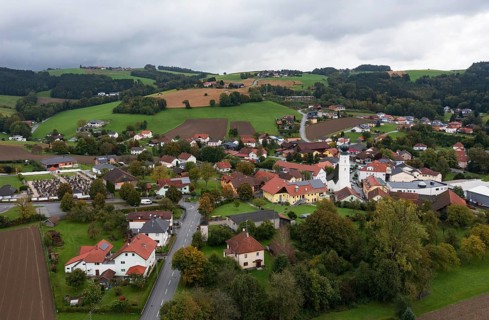 Drone shot, view of village with church, Enzenkirchen, Innviertel, Upper Austria, Austria, Europe