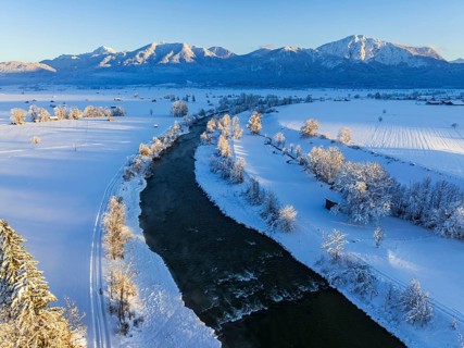 Aerial view of a river in front of mountains, evening light, snow, winter, Loisach, Alpine
