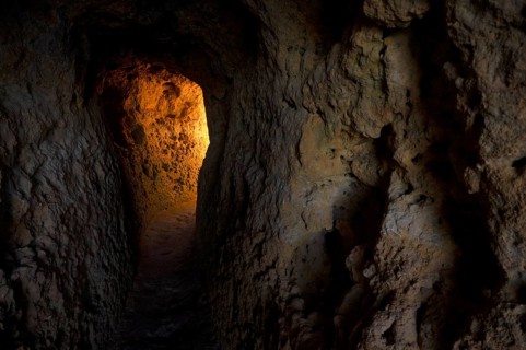 Light at the end of the tunnel, Algar Seco rock formation, coloured rocks and underground caves,