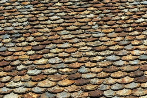 Traditional slate roof (lauze stone) in Auvergne volcanoes regional natural park, Puy de Dome