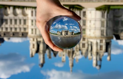 View of the Chateau de Chambord through a transparent ball. Loir-et-Cher department, Centre-Val de