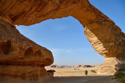 Tourists at The Arch, also known as Rainbow Rock, near AlUla, Medina Province, Saudi Arabia,