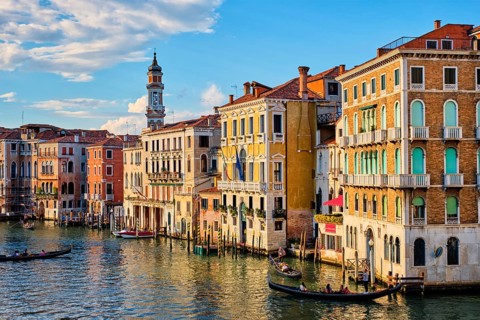 VENICE, ITALY, JUNE 27, 2018: Grand Canal with boats and gondolas on sunset, Venice, Italy, Europe