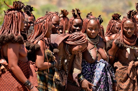 Mourning Himba women at a funeral, the widow in the middle, Omohanja, Kaokoland, Kunene, Namibia,