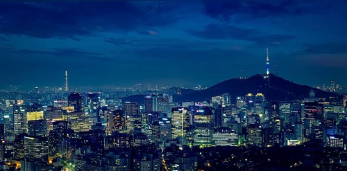 Panorama of Seoul downtown cityscape illuminated with lights and Namsan Seoul Tower in the evening