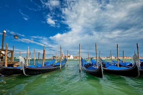 Gondolas and in lagoon of Venice by Saint Mark (San Marco) square with San Giorgio di Maggiore