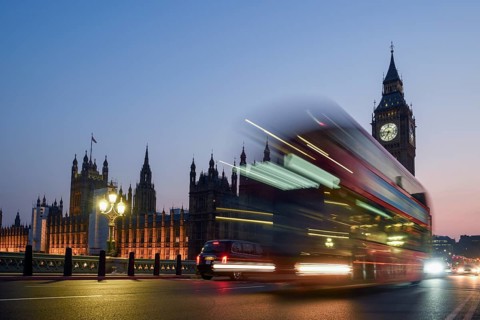 Red double-decker bus on Westminster Bridge, blue hour, Big Ben in the background, Westminster,